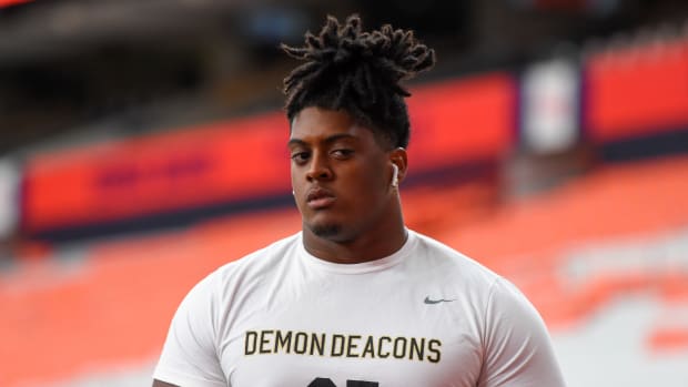 DL Dion Bergan Jr. warms up before the October 2021 game at Syracuse